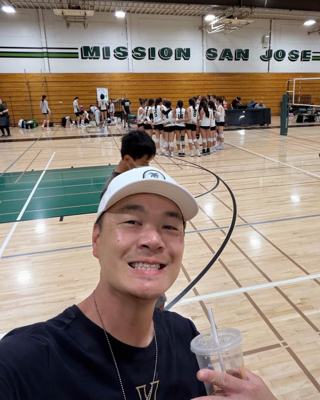 Mike Jan courtside in the Mission San Jose gym during a volleyball match